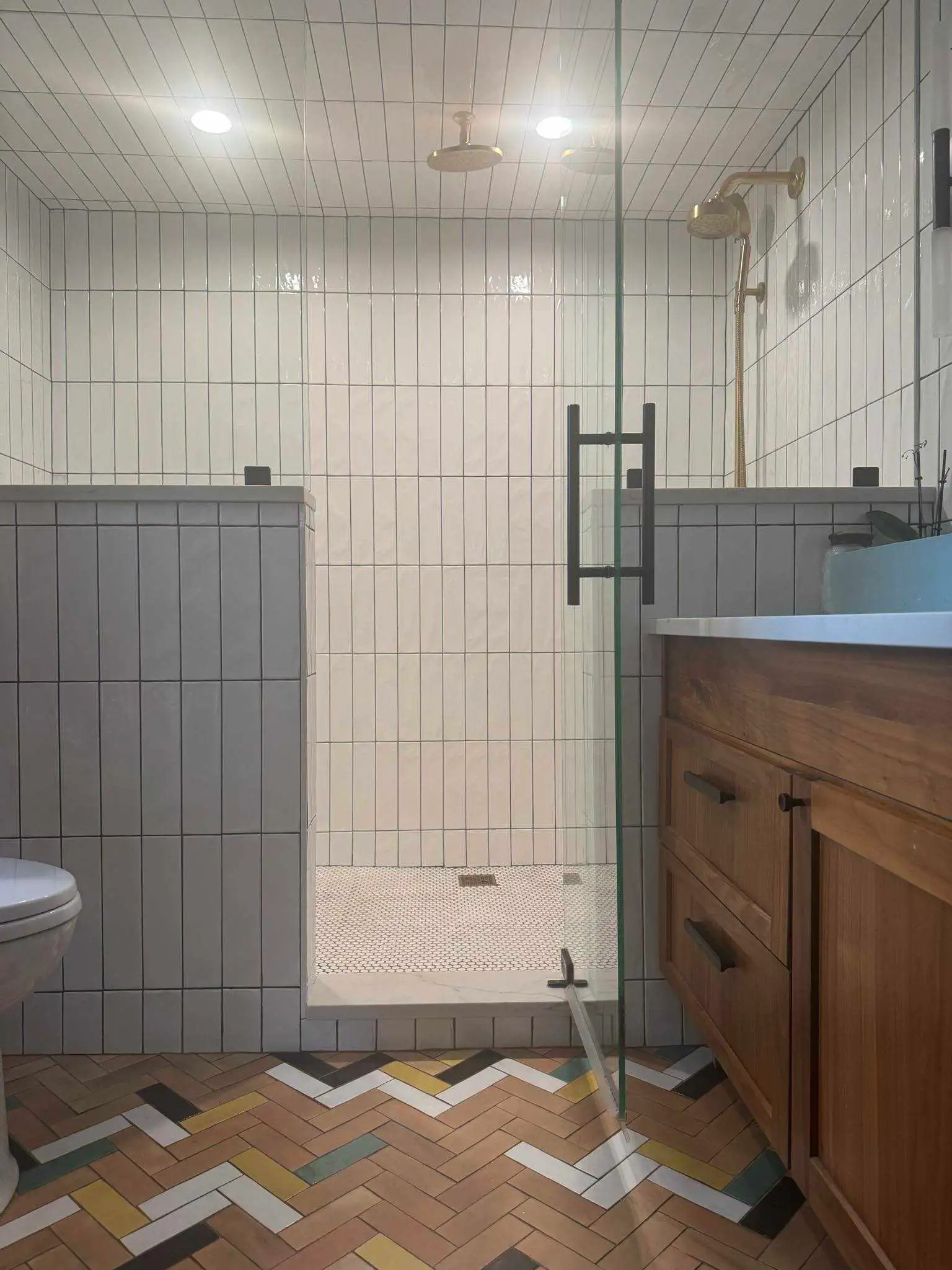 Clean tiled shower and vanity after bathroom cleaning